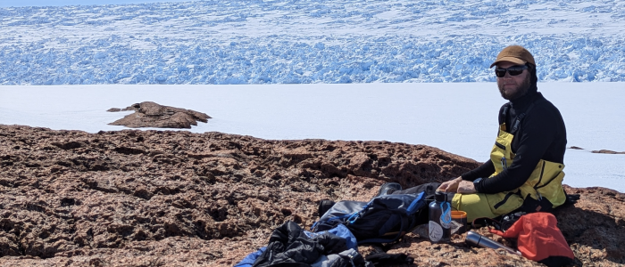 The Denman Glacier, East Antarctica, close to seismic site at Harrison Rocks. Niam Askey-Doran (field geophysicist, PhD student) in the foreground.
