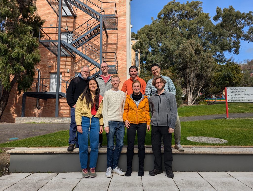 A group of four researchers standing together